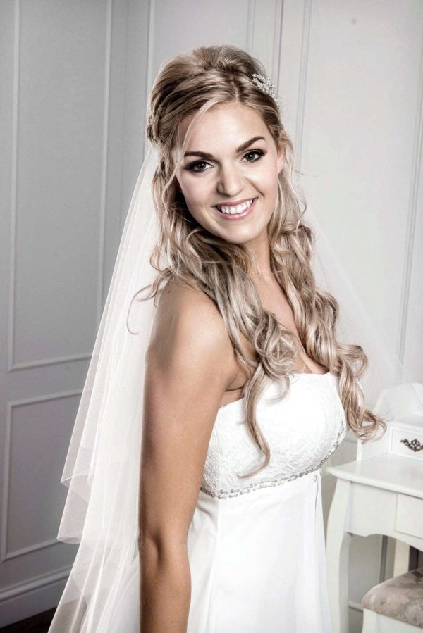 Bride wearing veil with half up half down hair