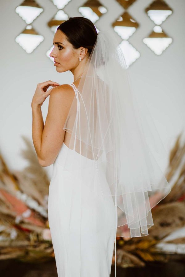 Megan- two layer hip length veil with a pencil edge