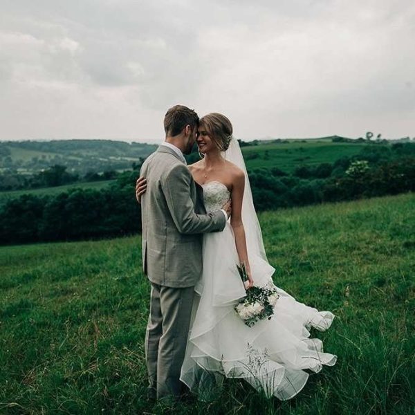 Two tier fingertip length scalloped edge veil on real bride Taisy