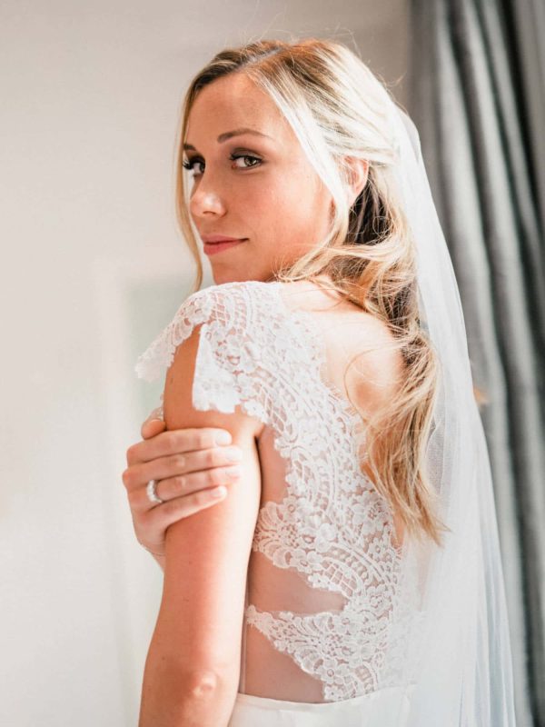 Pretty image of barely there veil on real bride Olivia