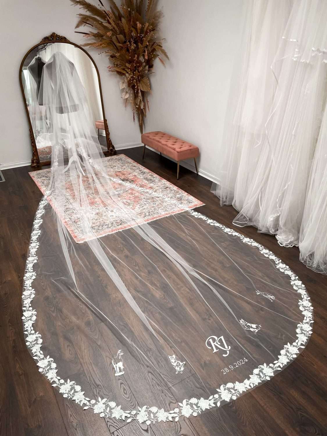 5m long bespoke lace veil with the family animals and a custom monogram 5m long bespoke lace veil with the family animals and a custom monogram