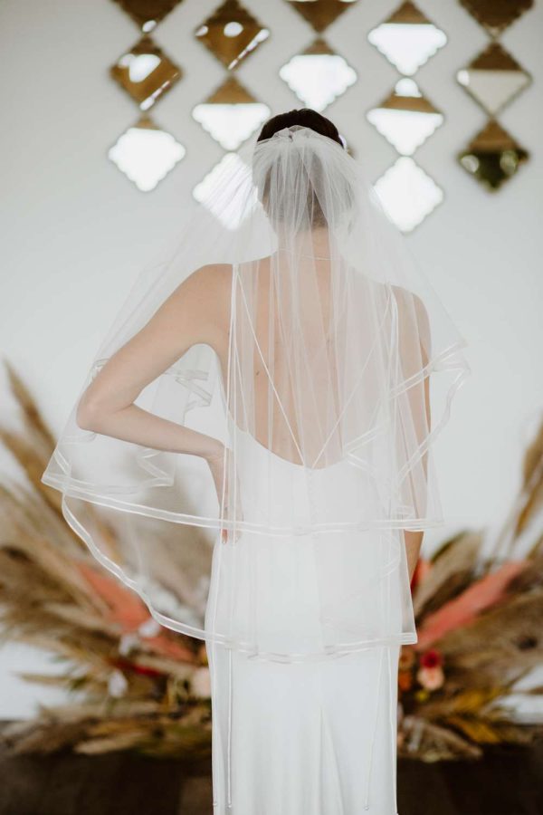 Candice - two tier hip length veil with a satin & organza ribbon edge