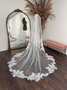 Cathedral veil with large lace motifs and a custom monogram and date