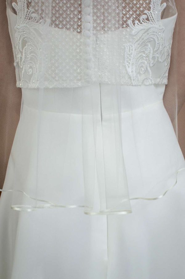 Daisy - one layer waist length veil with a pretty ribbon trim back closeup