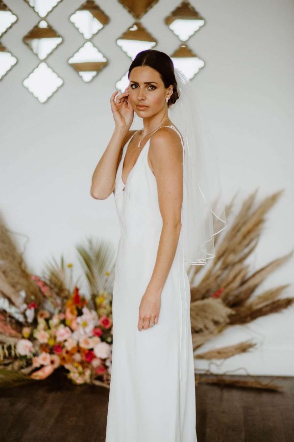 Daisy – one layer waist length veil with a pretty narrow ribbon trim