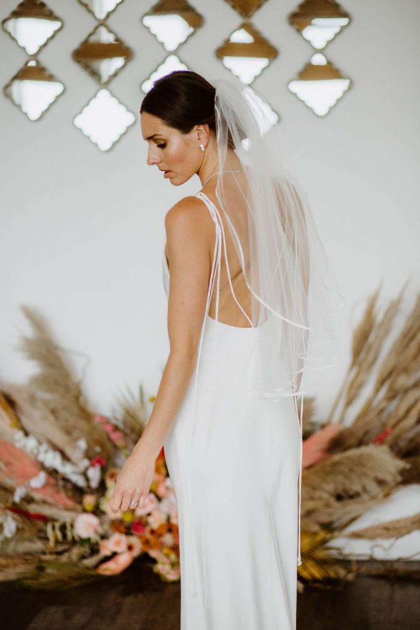 Daisy – one layer waist length veil with a pretty narrow ribbon trim back