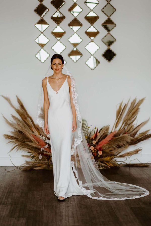 Harmony – single layer chapel length lace edged mantilla veil with comb