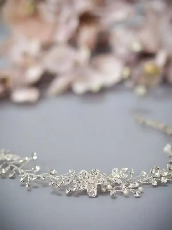 Dawn bridal hair vine on grey backdrop closeup