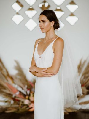 Matilda - two tier hip length drop veil with a cut edge and scattered pearls