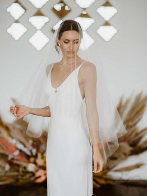 Matilda - two tier hip length drop veil with a cut edge and scattered pearls