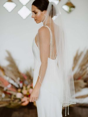 Tania - one layer fingertip length veil with a pearl edge