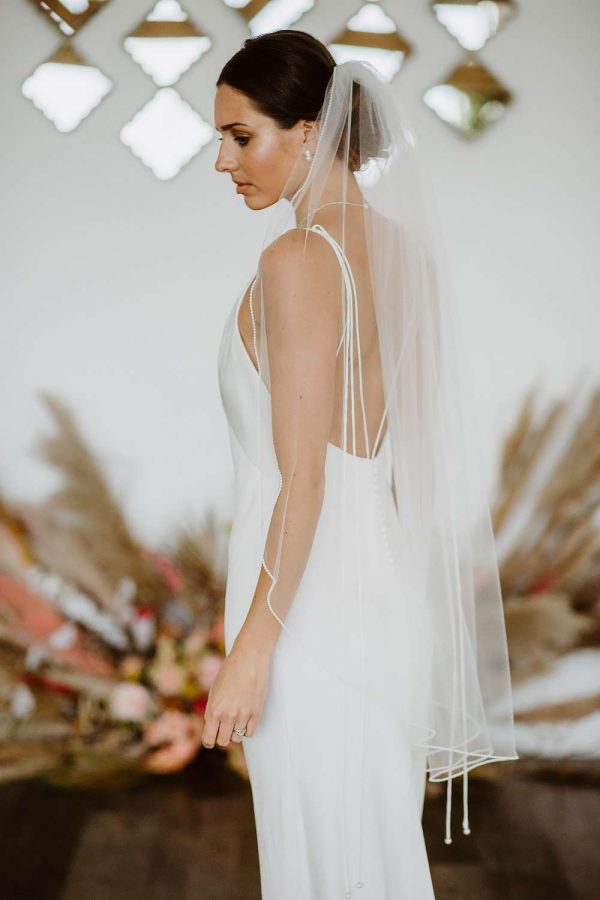 Tania - one layer fingertip length veil with a pearl edge