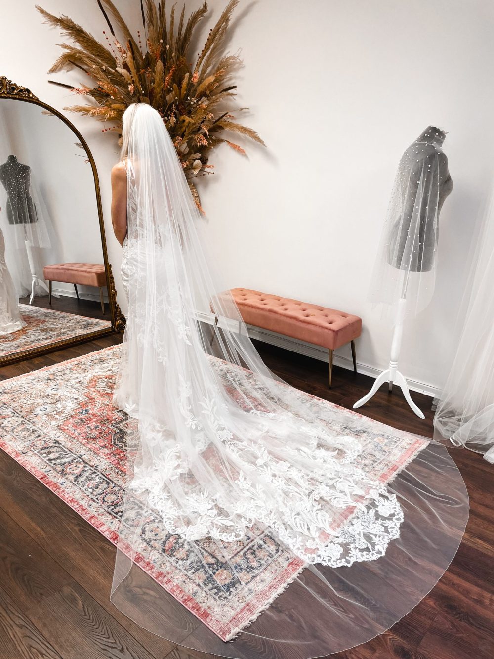 Bride trying on a veil at The Wedding Veil Shop Bride trying on a veil at The Wedding Veil Shop
