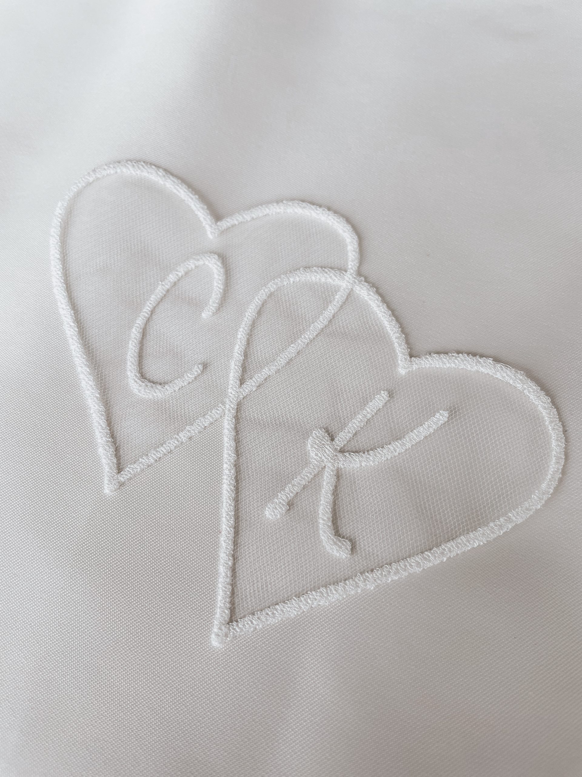 Entwined hearts embroidery closeup
