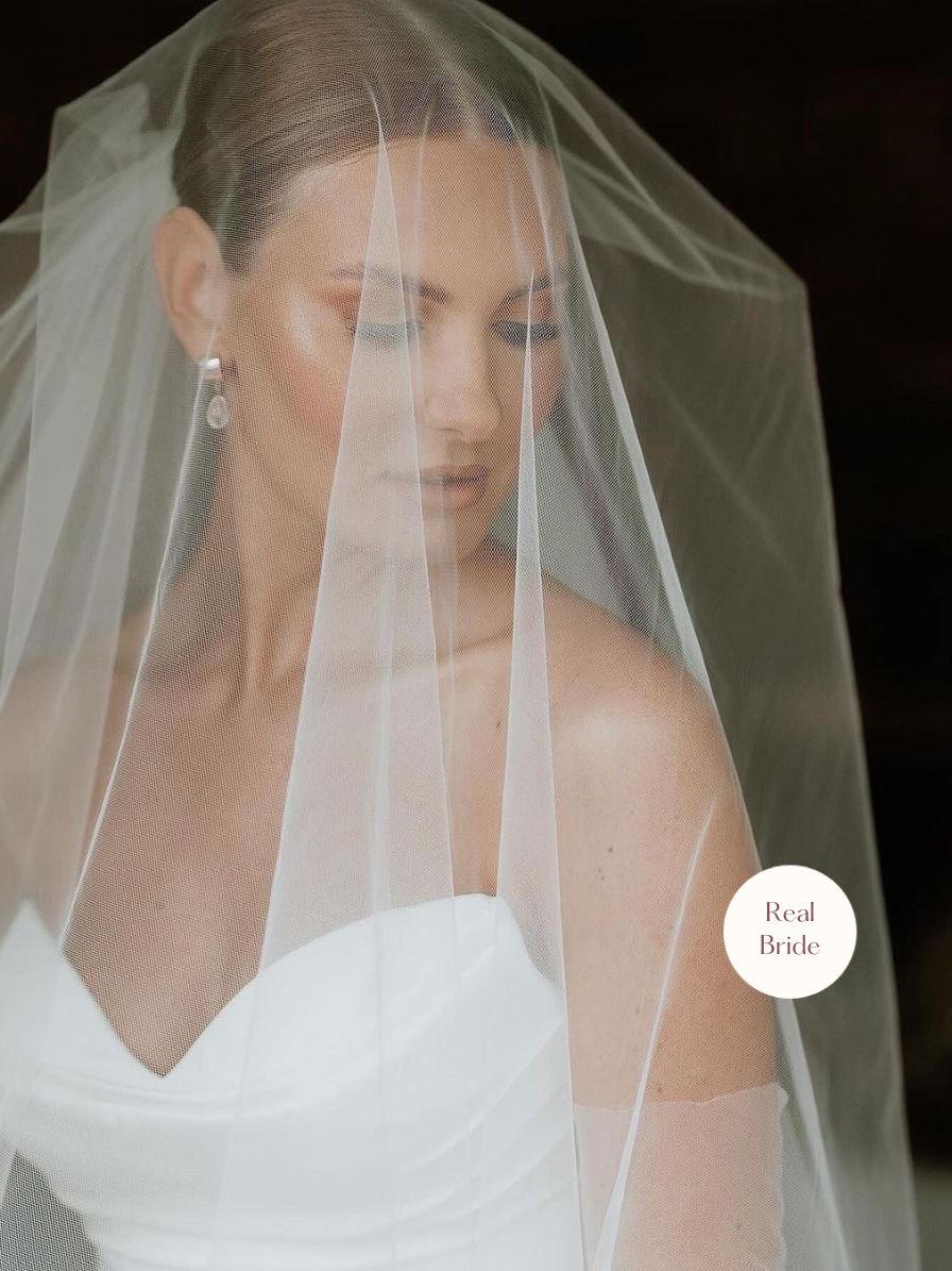 Anastasia – Classic Two Tier Cathedral Veil with a Cut Edge 13 Real bride wearing Anastasia