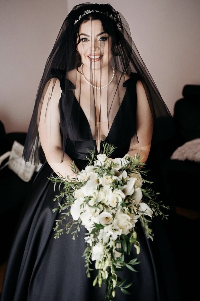 black dress and wedding veil on real bride