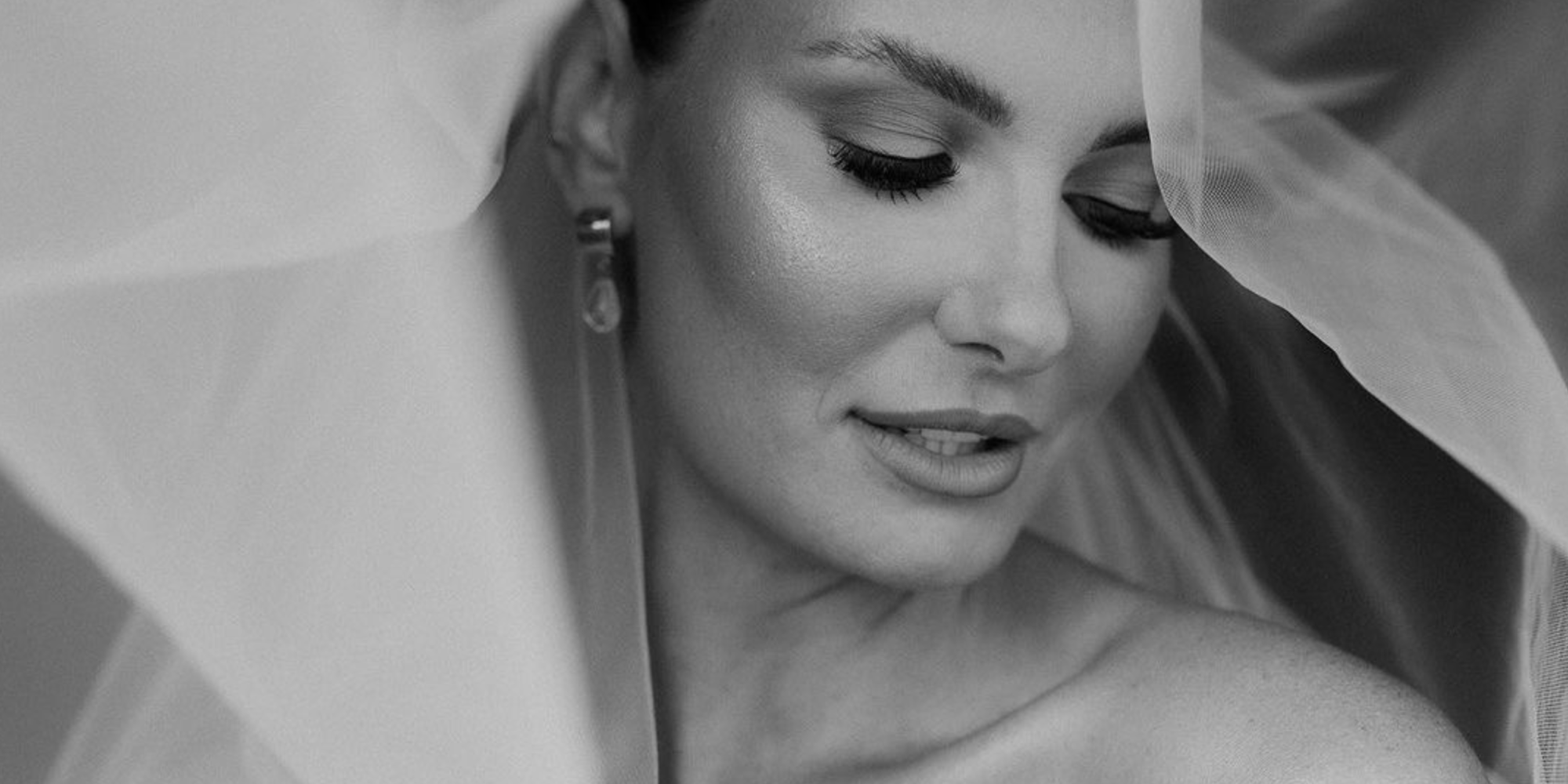 Close up of pretty bride wearing a wedding veil